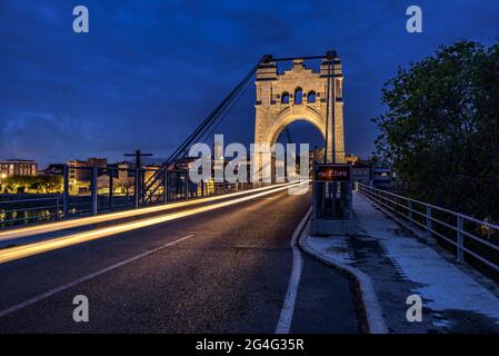Amposta Bridge, illuminated in the blue hour at twilight (Ebro River, Tarragona, Catalonia, Spain) ESP: Puente de Amposta, iluminado en la hora azul Stock Photo