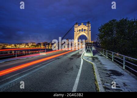 Amposta Bridge, illuminated in the blue hour at twilight (Ebro River, Tarragona, Catalonia, Spain) ESP: Puente de Amposta, iluminado en la hora azul Stock Photo