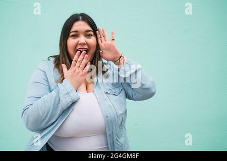 Young woman with shocked expression. Stock Photo