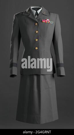 Military dress uniform comprised of a jacket with service ribbons and insignia, a skirt, a blouse with insignia, a beret with insignia, and a hat with insignia. The uniform was worn by Brigadier General Hazel Johnson-Brown, the first African American woman to achieve that rank and the first African American to serve as Chief of the Army Nurse Corps. Stock Photo