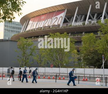 Tokyo, Japan. 21st June, 2021. Workers are seen walk outside of National Stadium in Tokyo, Japan on Monday, June 21, 2021. Photo by Keizo Mori/UPI Credit: UPI/Alamy Live News Stock Photo