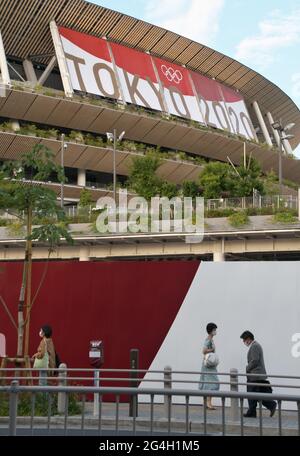Tokyo, Japan. 21st June, 2021. People is seen walk outside of National Stadium in Tokyo, Japan on Monday, June 21, 2021. Photo by Keizo Mori/UPI Credit: UPI/Alamy Live News Stock Photo