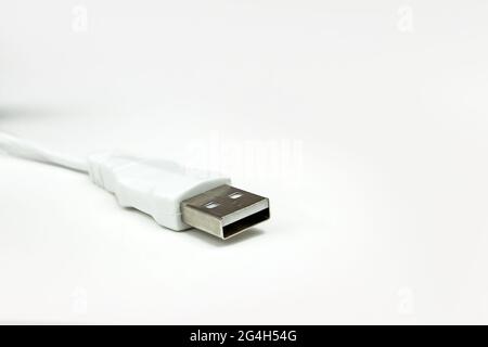 USB cable is white, on white background. A white USB type C charger cable. Stock Photo