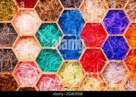 abstract multicolored hexagon patterned background with colored cut wrapping paper, abstract concept background Stock Photo