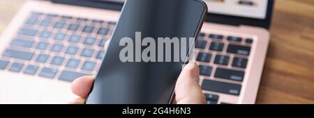Male hand holding Samsung Galaxy S21 closeup Stock Photo