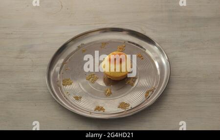 One last cupcake on a metal plate Stock Photo