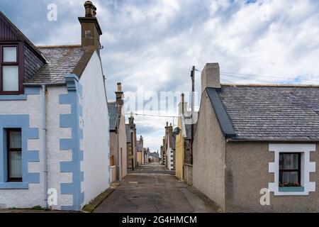 Narrow empty street between rows of cottages in portknockie, Moray, Scotland, UK Stock Photo