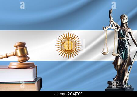 Law and justice in Argentina. Statue of themis and the gavel of the judge against the background of the flag of Argentina. Law and justice concept. Stock Photo