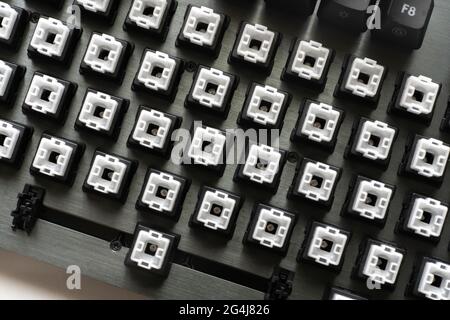modern mechanical keyboard switches, black and white keycaps on the desk Stock Photo
