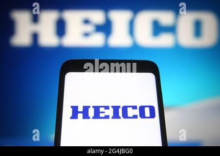 In this photo illustration a HEICO Corporation logo of an US aerospace and electronics company is seen on a smartphone and a pc screen. Stock Photo