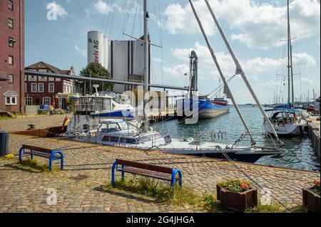 Fehmarn, Germany. 20th June, 2021. Various boats are moored in a pier in the Burgstaaken municipal harbour. The harbour basin is to be dredged to a depth of five metres so that the small harbour becomes competitive again. (to dpa 'Fehmarn wants to deepen Burgstaaken municipal harbour') Credit: Gregor Fischer/dpa/Alamy Live News Stock Photo