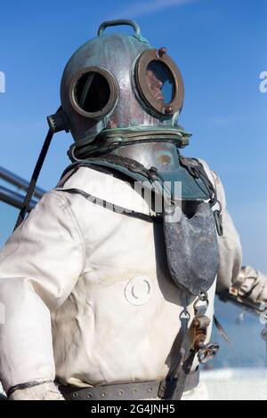 Deep-sea scuba suit at the entrance to the cafe on the waterfront Stock Photo