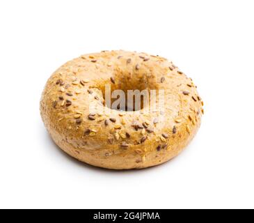 Whole grain baked bagel isolated on white background. Stock Photo