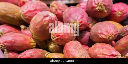 Clean prickly pear or barbary figs. Exhibited on cardboard box and packed tray Stock Photo