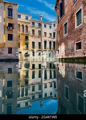 colorful water reflections in the empty canal without boats Stock Photo