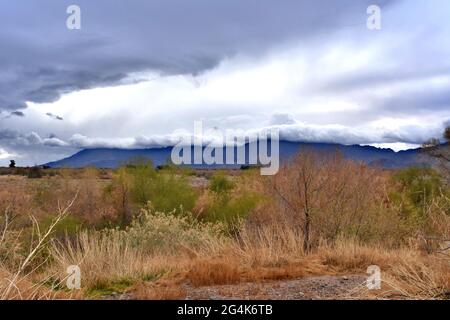 Foreboding storm clouds over a mountain top. Stock Photo