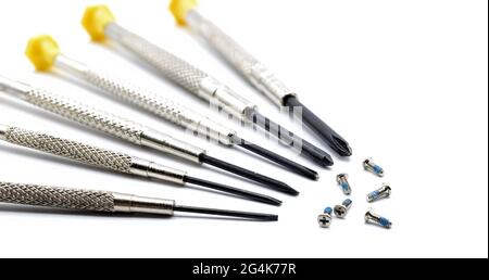 white background, copy spapce, precision screwdrivers with screws on white background Stock Photo