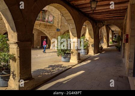 Arcades between the main square (Plaça Major) and the main street (Carrer Major) of Batea (Terra Alta, Tarragona, Catalonia, Spain)