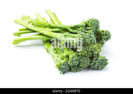 Raw broccolini heap isolated on white background Stock Photo