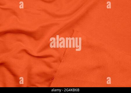 Background from orange monochrome cotton fabric. Close up texture Stock Photo