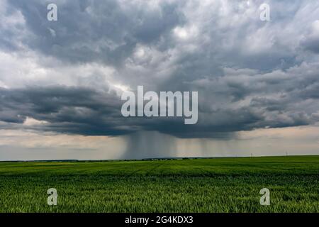 landscape with dark sky with rain clouds before storm. thunderstorm front Stock Photo