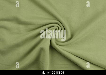 Background from green monochrome cotton fabric. Close up texture Stock Photo