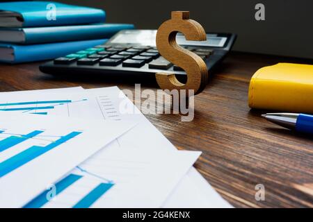 Success in investing and earning concept. Dollar sign and financial report. Stock Photo