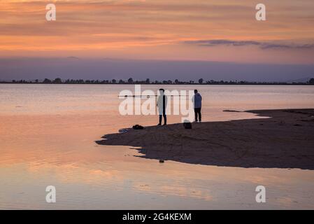 Sunset at the Trabucador beach in the Ebro Delta (Tarragona, Catalonia, Spain) ESP: Atardecer en la Playa del Trabucador en el Delta del Ebro Stock Photo