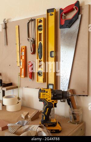 A collection of hand tools on a work bench Stock Photo