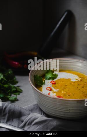 Homemade Indian Pumpkin Dahl with Coconut cream, coriander, chilli and masala herbs Stock Photo