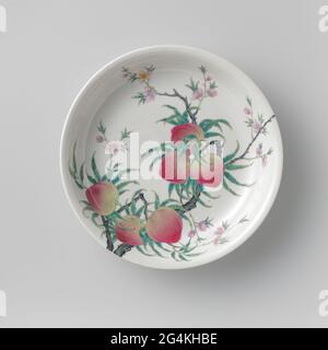 Saucer-dish with a Peachtree and a fungus. Scale of porcelain, painted on the glaze in blue, red, pink, green, yellow, purple and black. With a continuous peach tree with fruits and blossoms from the foot ring over the outside to the inner wall and on the flat; In addition to the trunk on the outside, a mushroom (Lingzhi). Marked on the underside with the six character mark of Emperor Qianlong. Family Rose. Stock Photo