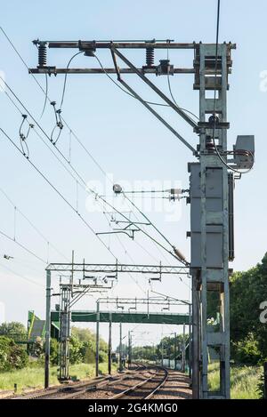 Electrified train tracks / railway lines, transport infrastructure. Stock Photo