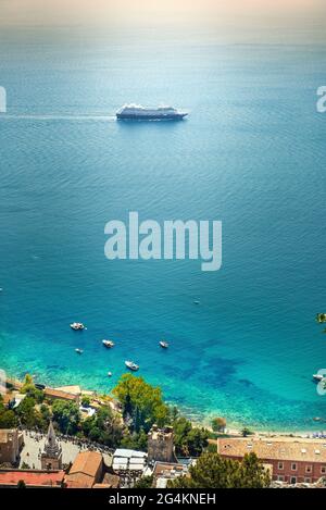 Cruise ship on the Mediterranean sea in front Taormina, Sicily, Italy, Europe Stock Photo