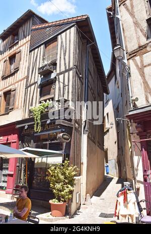 Restored medieval houses in rue de la Boucherie, in Limoges, France, the former shambles, butchers quarter, now occupied by restaurants, boutiques etc Stock Photo