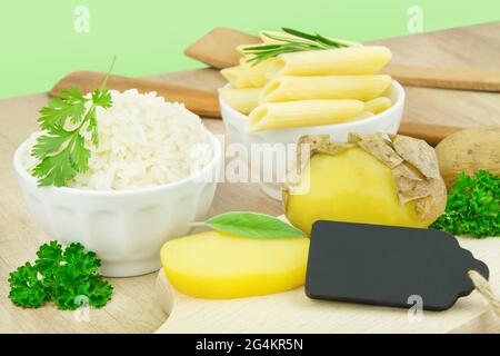 Cooked and cooled potatoes in the skin and rice with pasta Stock Photo