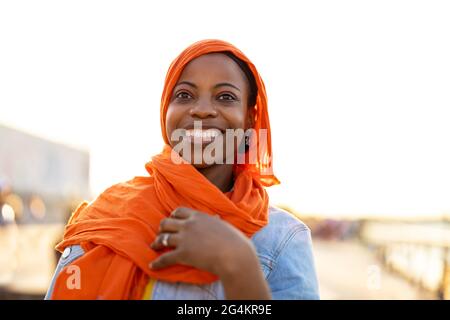 Young woman in hijab outdoors at sunset Stock Photo