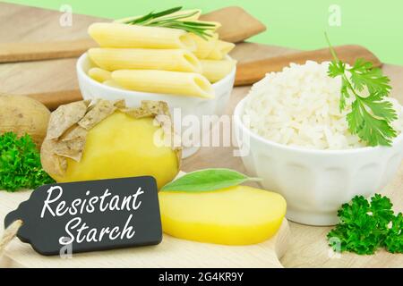 Cooked and cooled potatoes in the skin and rice with pasta Stock Photo