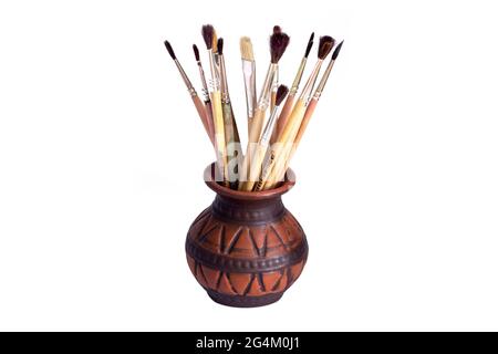 Brushes for painting in a vase on a white background Stock Photo