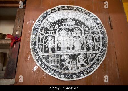 A traditional scroll painting, for sale, in a house at art village Raghurajpur, Odisha. They use natural colors to paint these traditional paintings. Stock Photo