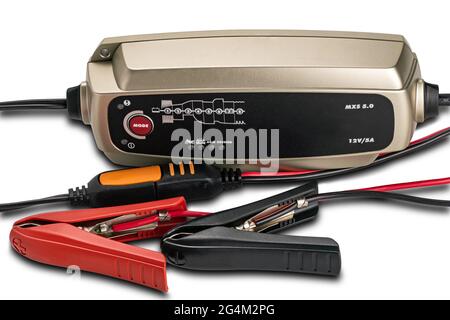 Portable battery chargers instrument with input  output cables and jumpers on white background with clipping path. Stock Photo