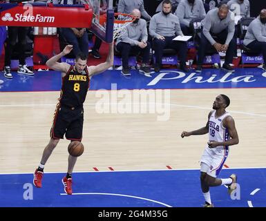 Philadelphia, USA. 20th June, 2021. Atlanta Hawks forward Danilo Gallinari slams for two, breaking away from Philadelphia 76ers guard Shake Milton after forcing a turnover against Joel Embiid to take a 98-92 lead with 41 seconds left in game seven on the way to a 103-96 victory in their NBA Eastern Conference semifinals series on Sunday, June 20, 2021, in Philadelphia. (Photo by Curtis Compton/Atlanta Journal-Constitution/TNS/Sipa USA) Credit: Sipa USA/Alamy Live News Stock Photo