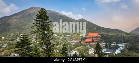 Panoramic landscape with Po Lin Monastery in Ngong Ping, located in the western part of Lantau Island, Hong Kong. Stock Photo