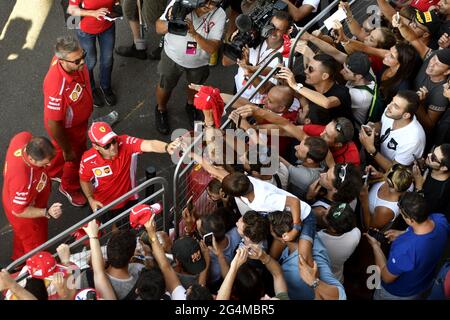 Ferrari's Formula 1 driver, Sebastian Vettel, signs autographs to the fans, during the F1 Milan Festival, 2018, in Milan. Stock Photo