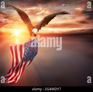 Eagle With American Flag Flies In Freedom At Sunset - Vintage Toned Stock Photo