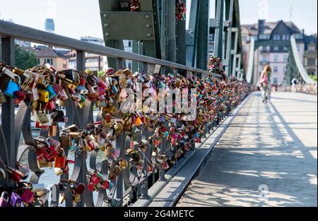 Love locks on the Eiserner Steg in Frankfurt am Main with a view towards Sachsenhausen Stock Photo