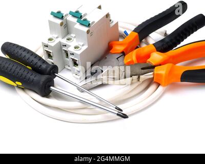 set of electrician tools and equipment and a coil of wire on a white background, focus on cutter Stock Photo