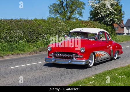 1949 1940s forties Red custom Chevrolet American custom Chevy 3540 cc, en-route to Capesthorne Hall classic & vintage car show, Cheshire, UK Stock Photo