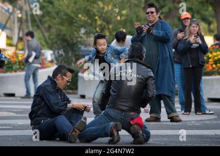 A group of men in biker leathers dancing in Yoyogi Park near Harajuku, Tokyo, Japan Stock Photo