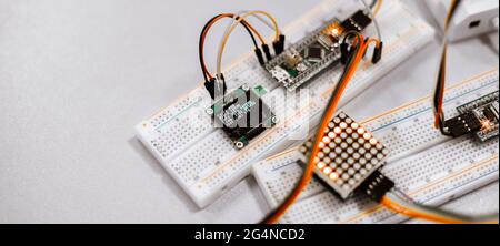 professional engineer assemble the details of device with pcb controller and counter with numbers Stock Photo