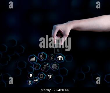 woman's hand holding cyber security padlock concept on future network technology background. Stock Photo